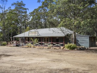 Substantial Residence and outbuildings on large waterfront acreage